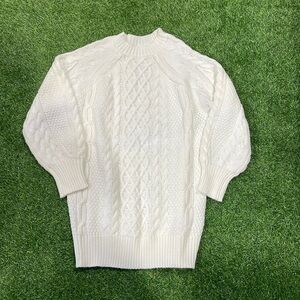 Ladies cream cable knit knee length sweater dress.